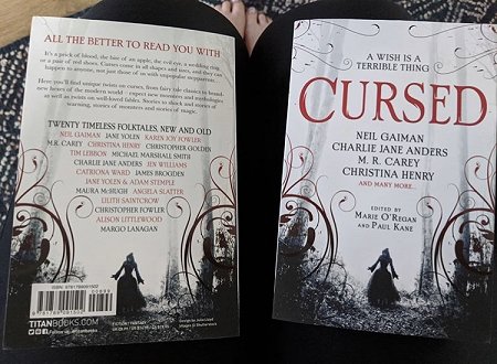 Front and back covers of Cursed, edited by Marie O'Regan and Paul Kane
