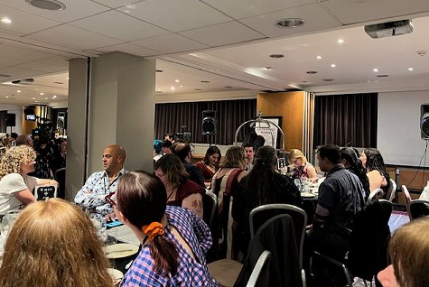 photograph of a filled banquet room at FantasyCon, the room is filled with round tables, where authors are seated for the awards ceremony