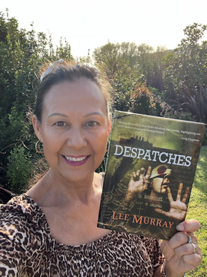 author Lee Murray holding up a copy of her Absinthe Books novella DESPATCHES, which is on the preliminary ballot for the Bram Stoker Awards&reg;