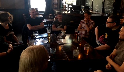 L to R: Linda Carey, M.R. Carey, Eric Ian Steele, David Watkins, Steve Shaw, Phil Sloman. Front: Laura Mauro