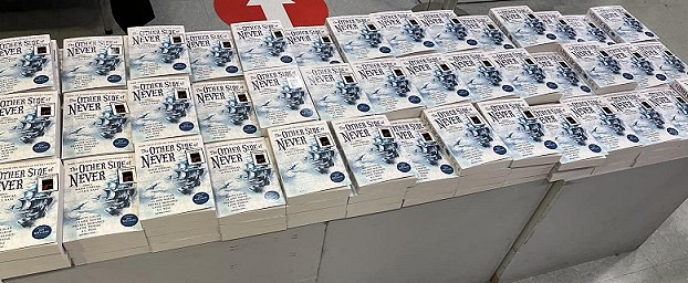 Book display - multiple copies of The Other Side of Never, edited by Marie O'Regan and Paul Kane
