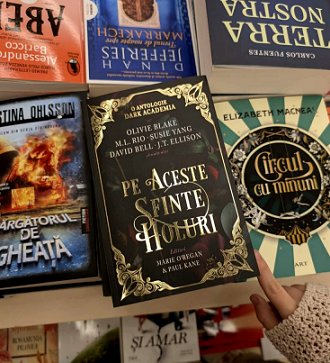 photograph of a book display, featuring the Romanian edition of In These Hallowed Halls, edited by Marie O'Regan and Paul Kane