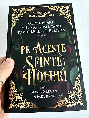 photograph showing a copy of the Romanian edition of In These Hallowed Halls, edited by Marie O'Regan and Paul Kane, against a white background