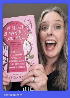 photograph of an excited Megan Bannen holding up a copy of The Secret Romantic's Book of Magic, edited by Marie O'Regan and Paul Kane
