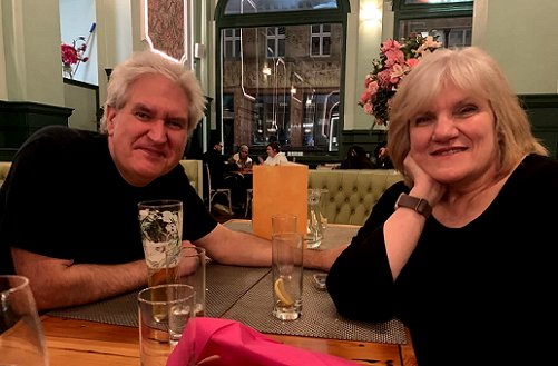 Photograph shows, from L to R: a smiling Paul Kane and Marie O'Regan at The Giggling Squid, Leeds
